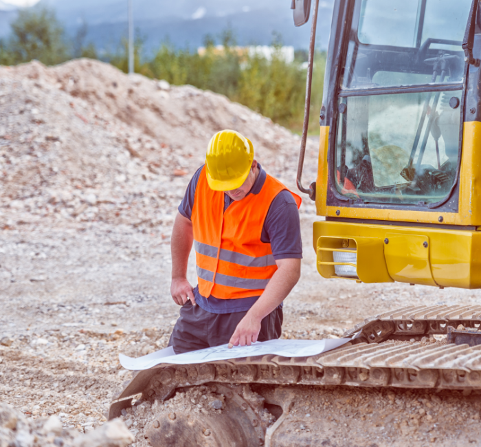 Digger driver checking plans